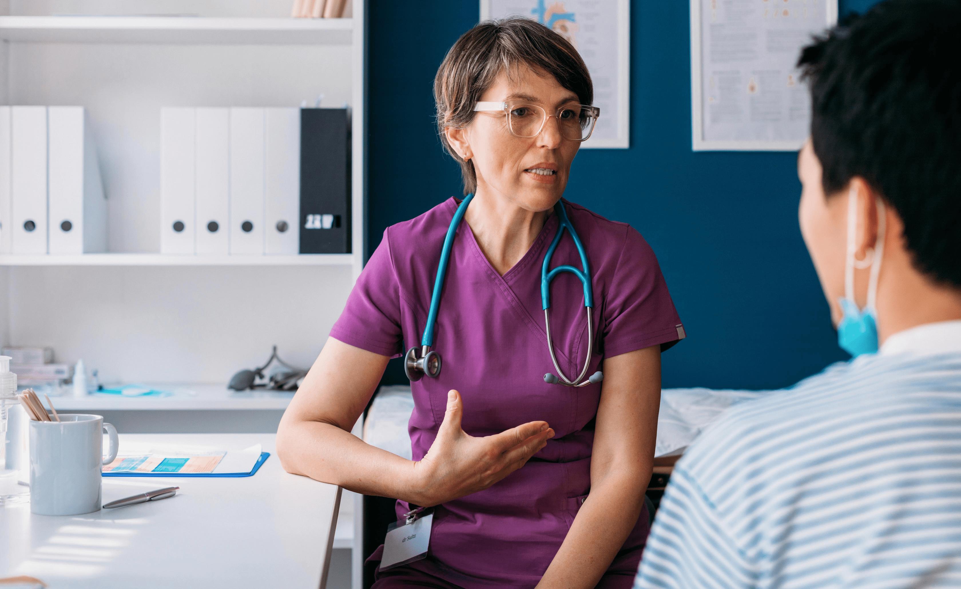 nurse speaking with patient