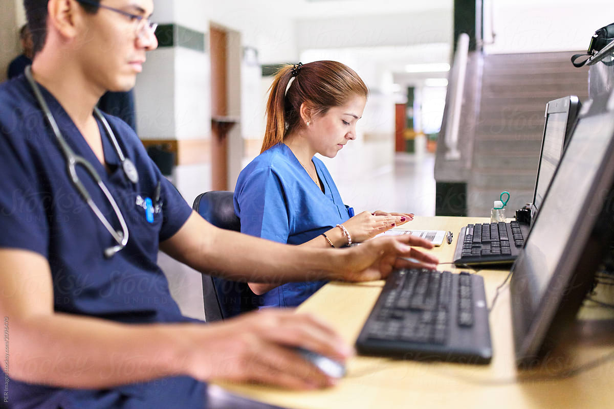 multiple providers working at computer desk