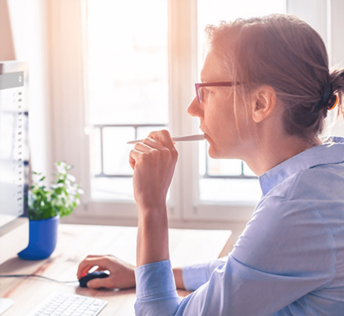 woman thinking at computer