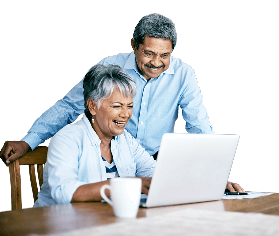 Man and woman smiling looking at laptop computer