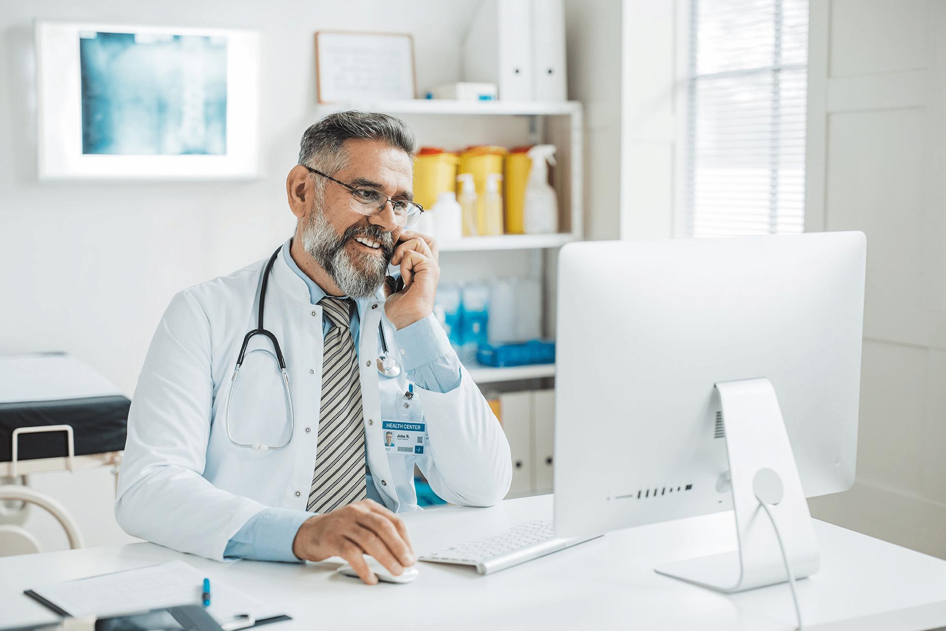 provider on phone working at desk