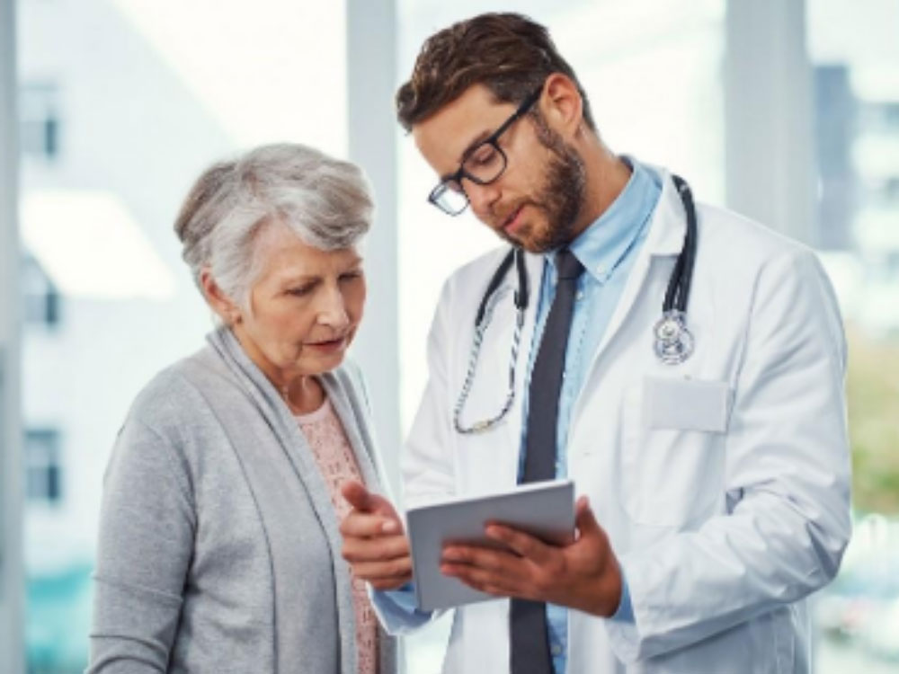 doctor speaking with an elderly patient
